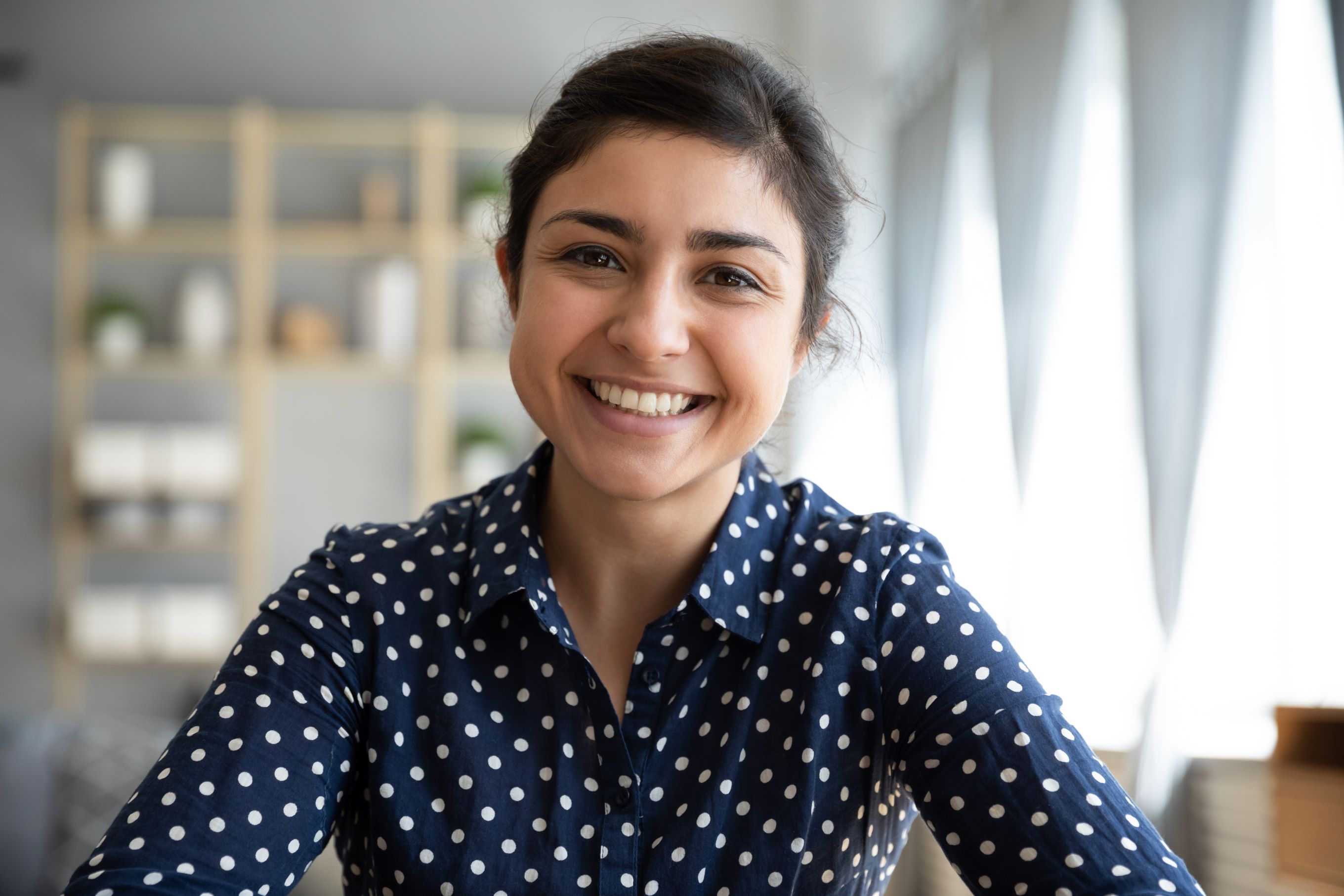 Woman in a Blue Shirt Smiling